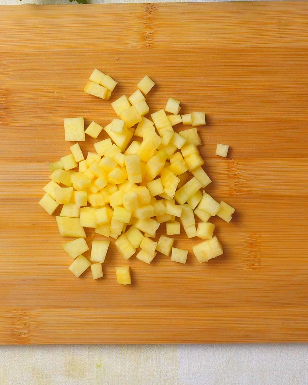 Finely diced pumpkin on a chopping board
